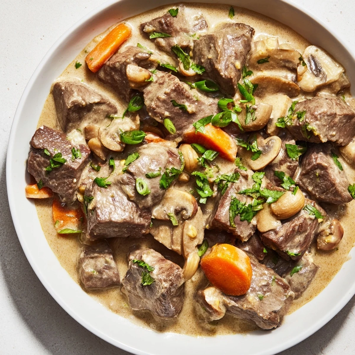 In this Lemongrass Coconut Braised Beef with Mushrooms, tender beef chunks glisten in a creamy coconut lemongrass sauce next to quartered cremini mushrooms. 