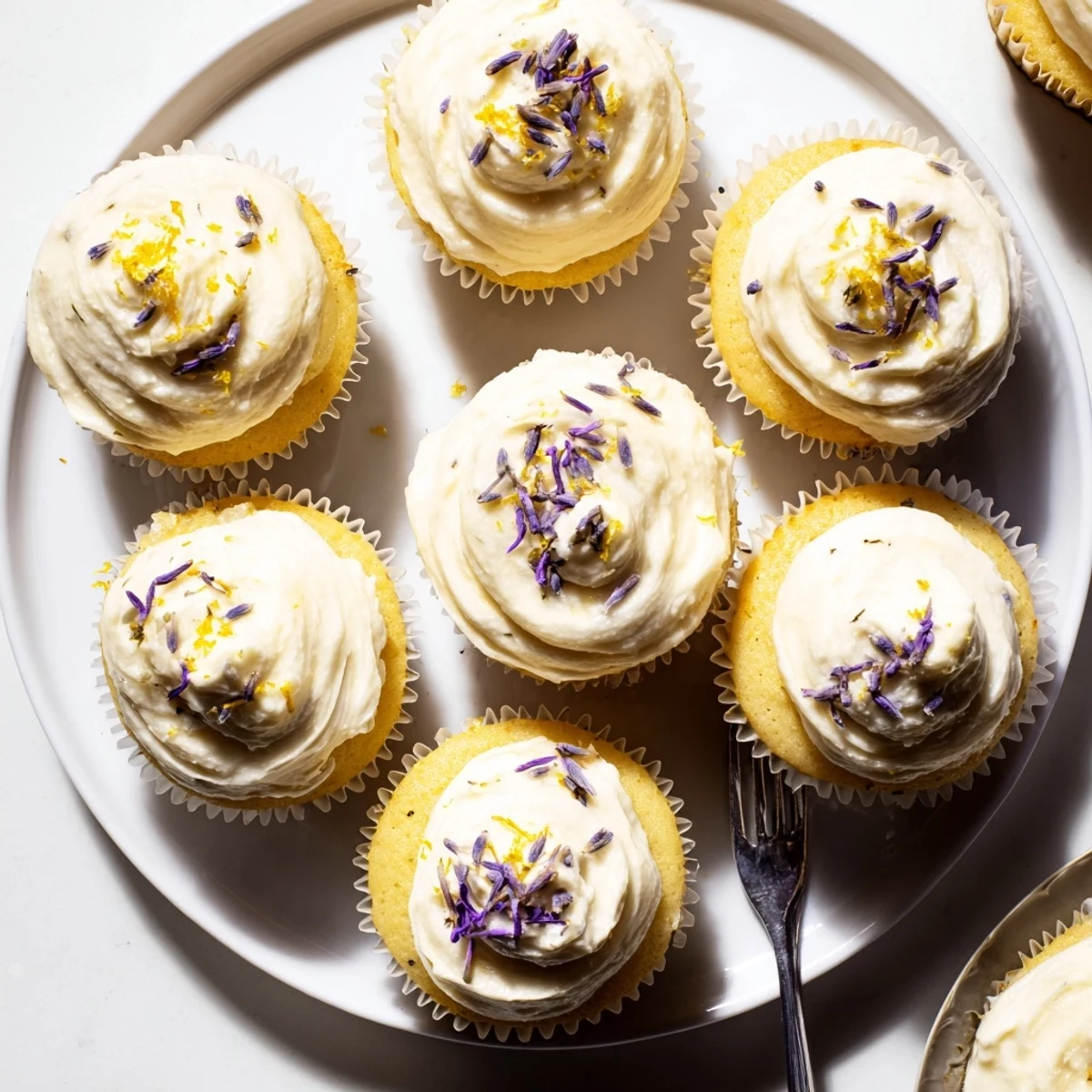 Golden lemon lavender cupcakes with zesty citrus flavor and aromatic floral notes, perfect for spring desserts