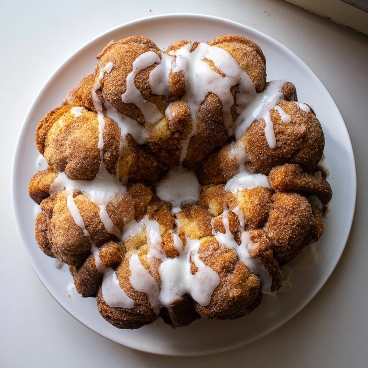 Golden high protein no sugar monkey bread with cinnamon coating in a bundt pan