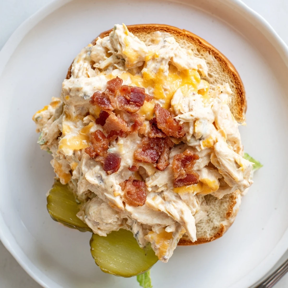 Fresh-baked Crack Chicken Sandwiches bubbling creamy, cheesy chicken topped with bacon