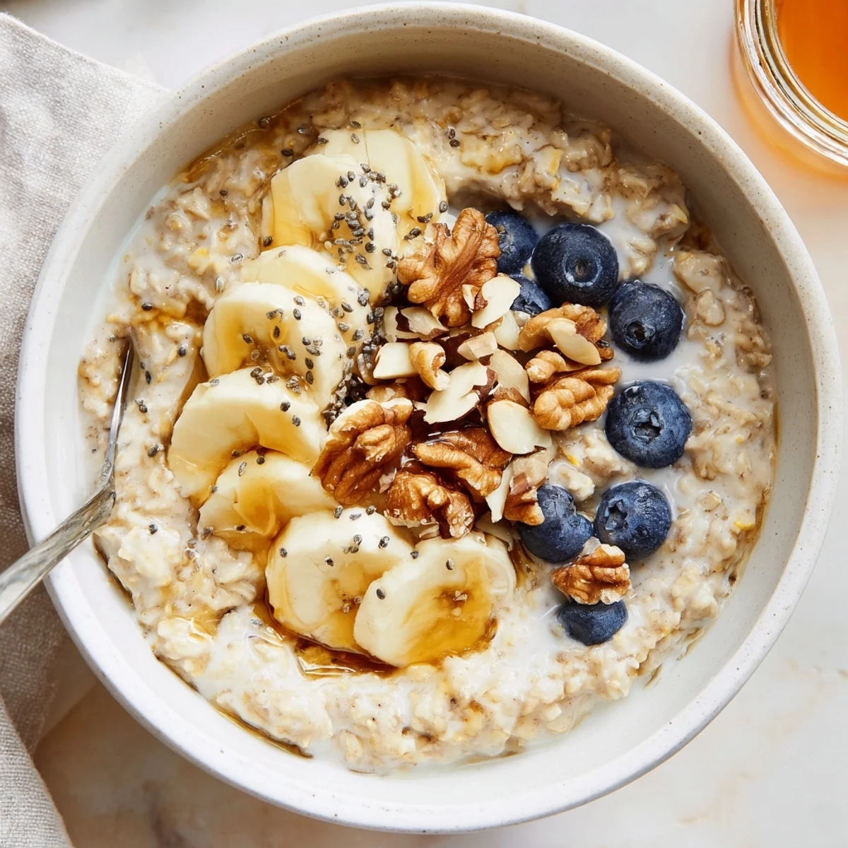 Vanilla Protein Oatmeal stirred smooth, drizzled with maple and fresh berries.