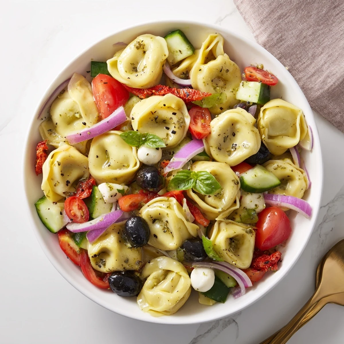 Creamy Tortellini Pasta Salad tossed in zesty Italian dressing, served cold