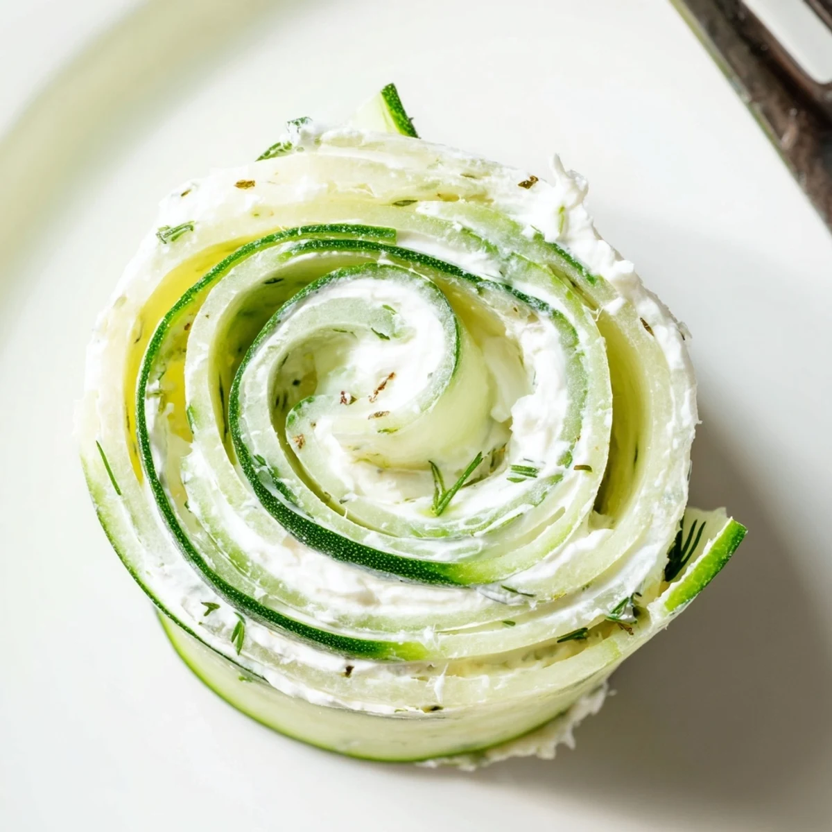 Handheld Cucumber And Dill Pinwheels, soft tortilla rolls sliced, bright herb aroma