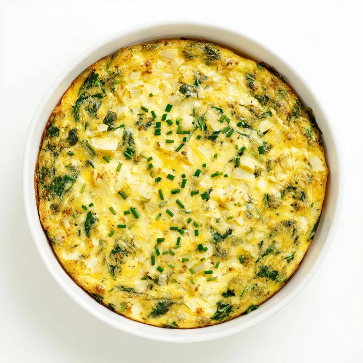 Savory no-crust cottage cheese quiche pie with tender spinach specks ready for brunch serving