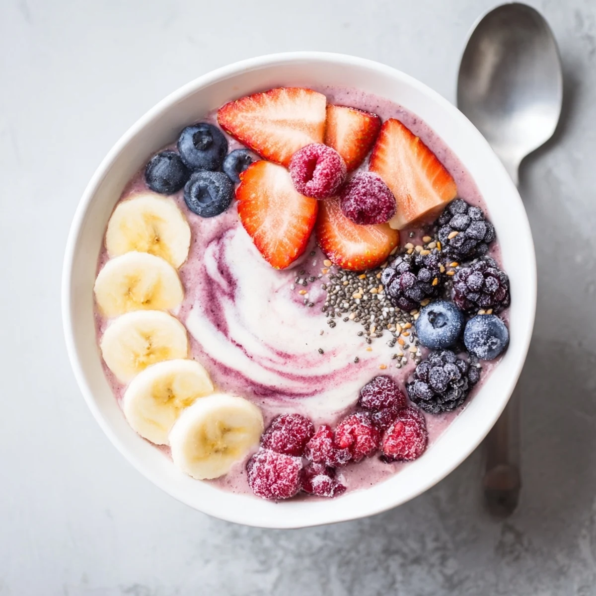 Glass of Summer Berry Smoothie glistening, creamy texture with fresh berries