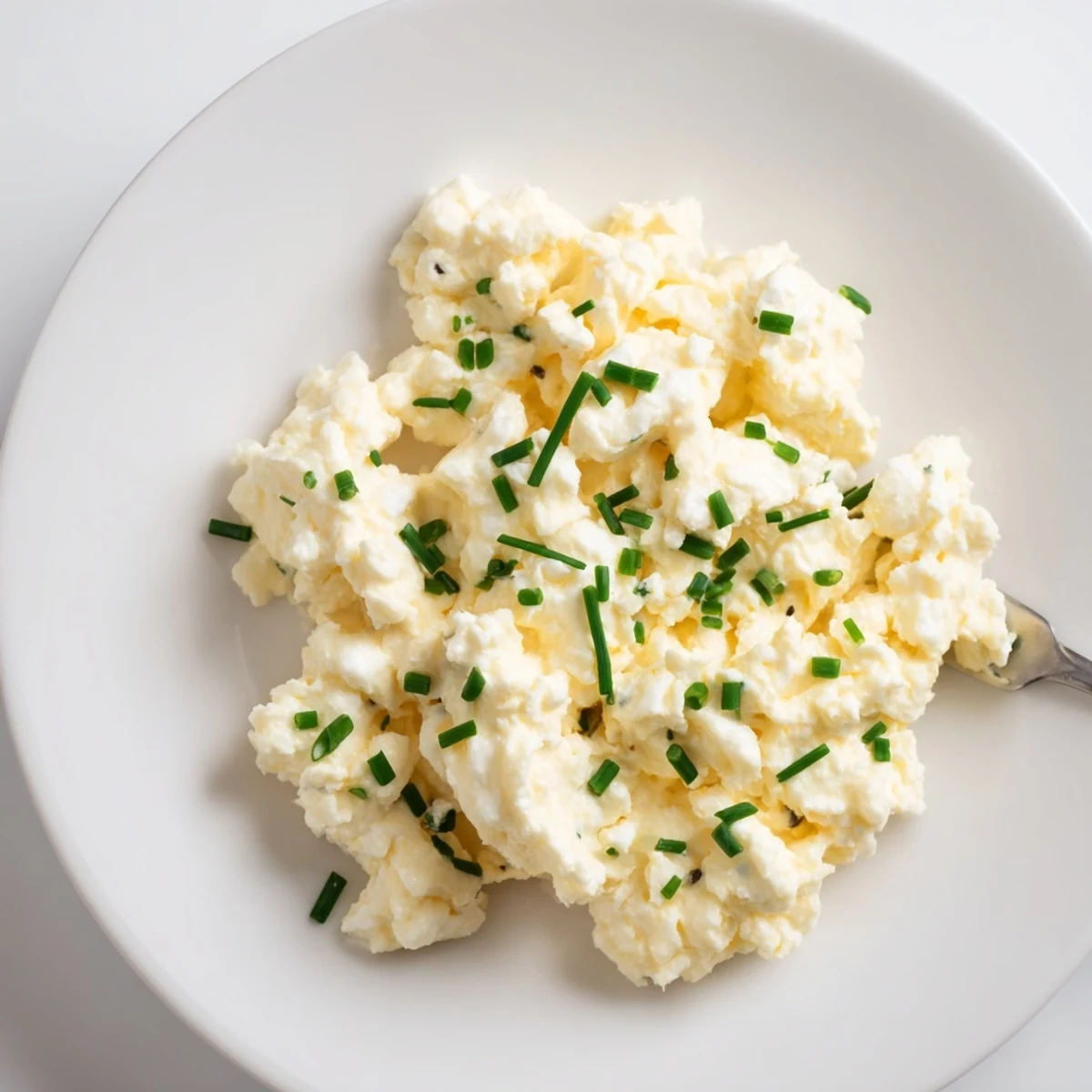 Buttery, creamy Cottage Cheese Scrambled Eggs with Chives on toasted sourdough
