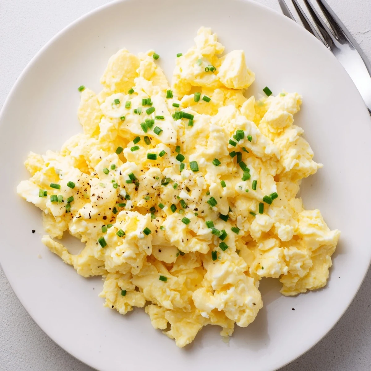 Herby, protein-rich Cottage Cheese Scrambled Eggs with Chives served for brunch