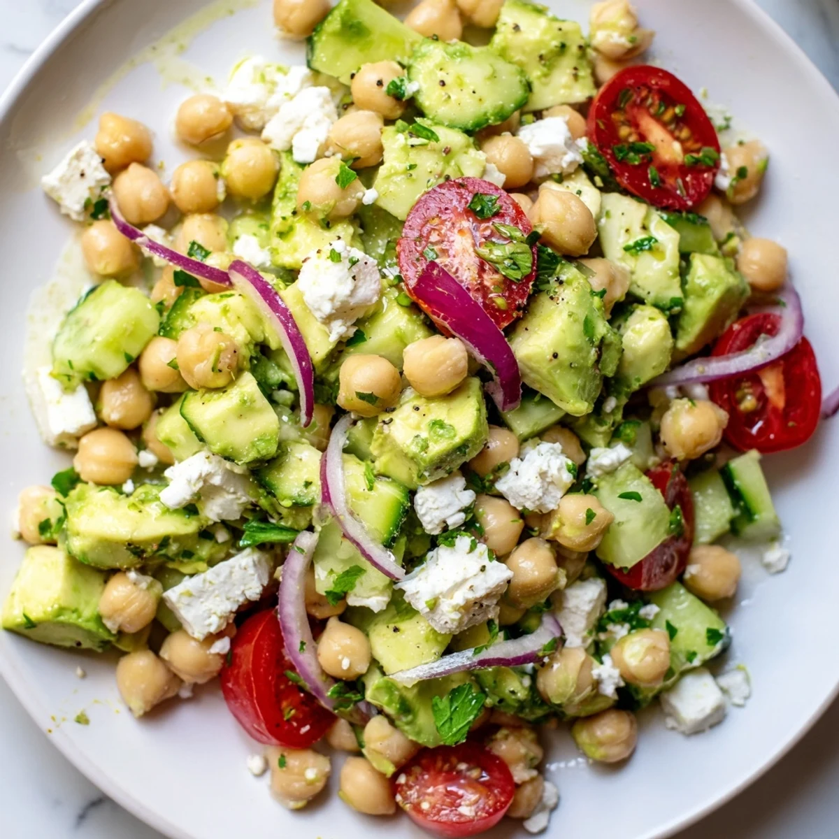 Creamy Chickpea Feta Avocado Salad tossed with fresh herbs and lemon dressing