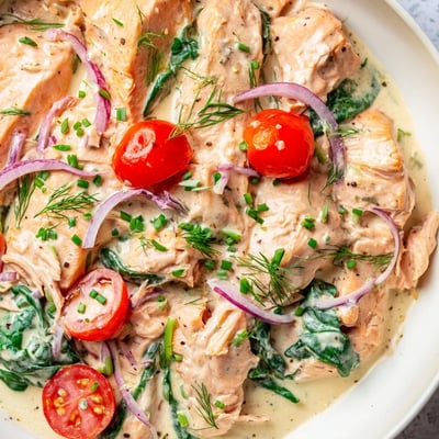 Healthy creamy leftover salmon recipe topped with fresh chives and bright lemon zest